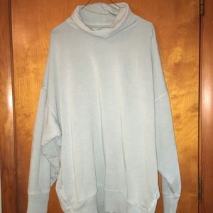 An oversized turtle neck sweater